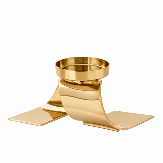 Brich & Bronze Auric Wave candle holder with sleek, modern design in metallic finish, showcasing a curved, wave-like shape.