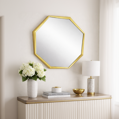 Brich & Bronze Octavia faceted wall mirror with geometric faceted glass frame hanging on a wall.