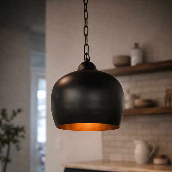 Black and copper designer dome pendant light by Kehf Al Fateh showing a sleek, modern ceiling fixture with a smooth, rounded shade.