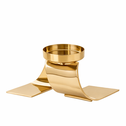 Brich & Bronze Auric Wave candle holder with sleek, modern design in metallic finish, showcasing a curved, wave-like shape.