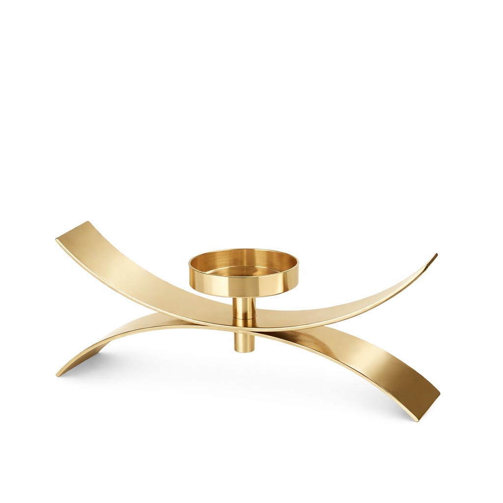 Brich & Bronze Xerra Arc Gold candle holder with sleek, curved design and a polished gold finish on a neutral background.