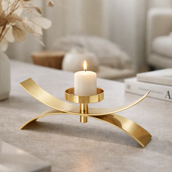 Brich & Bronze Xerra Arc Gold Candle Holder with curved design, perfect for decorative or ambient lighting displays.