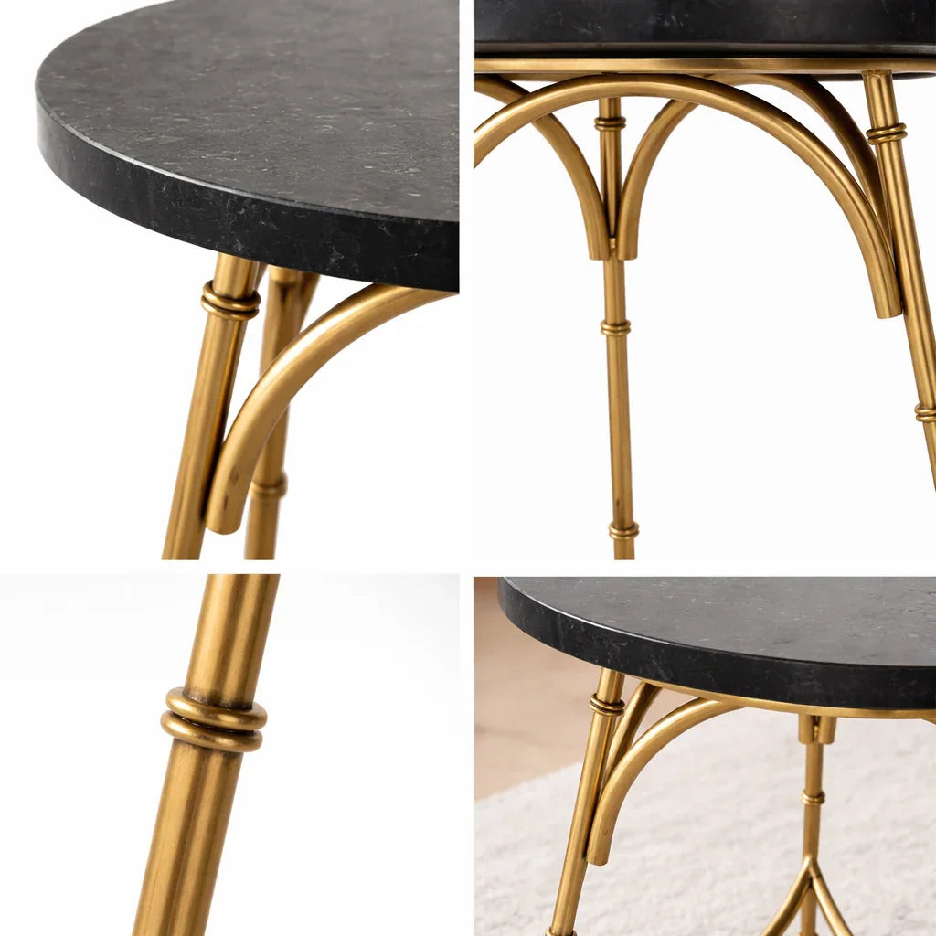 Round black marble table with gold metal legs, luxury furniture detail closeup